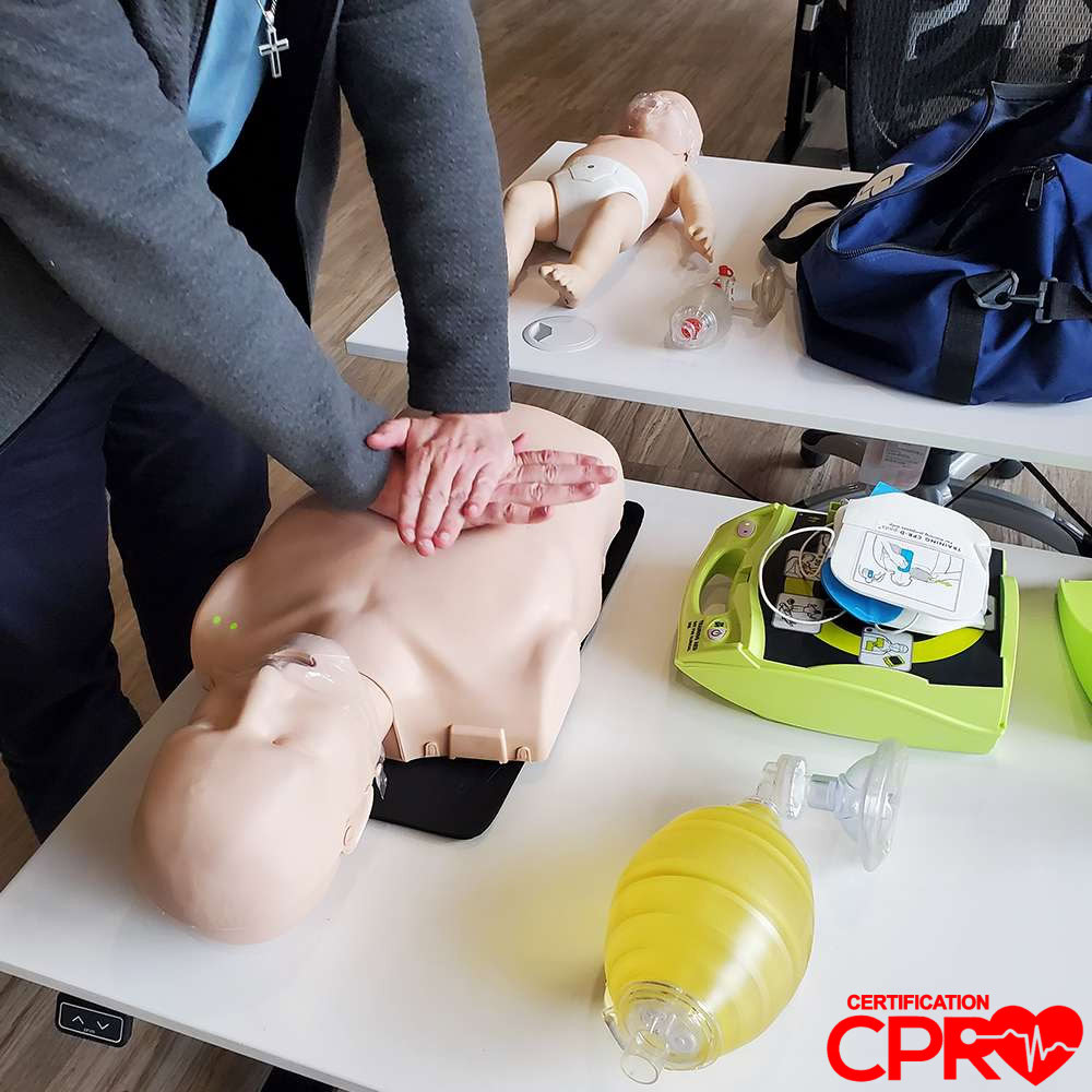 CPR training on mannequin for certification in Boston.