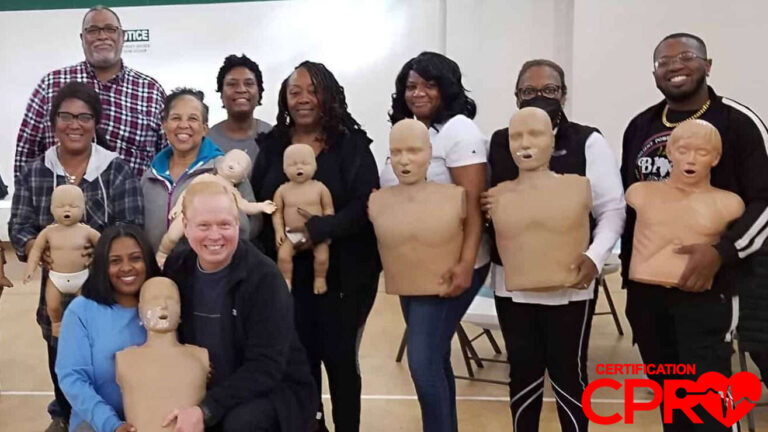 Group CPR training session in Boston with mannequins for certification.